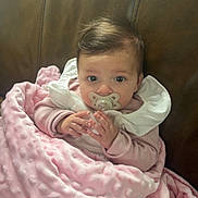 Athena joined the competition — help win amazing prizes! baby, blanket, pacifier, couch, leather, pink, child, infant, soft, texture, clothing, sitting, hands, face, portrait, cute, indoors, young, comfort, cozy