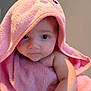 Athena is registered to the contest to win money with this photo: baby, child, pink_towel, hood, cute, portrait, indoor, face, infant, soft_texture, wrapped, looking, young_child, adorable, skin, person, towel, expression, closeup, calm