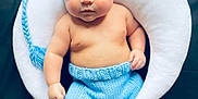 Christopher joined the competition — help win amazing prizes! baby, baby_fashion, bare_chest, black_background, blue_clothing, child, cozy, crescent_moon_pillow, cute, indoors, infant, knitted_hat, knitted_pants, laying_down, newborn, portrait, sleepy, soft_toys, star_cushions, white_pillow