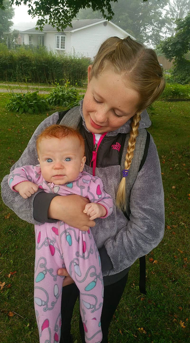 Renee joined the competition — help win amazing prizes! baby, child, daughter, grass, joy, mother, people, person, pink, sibling, skin, smile, toddler