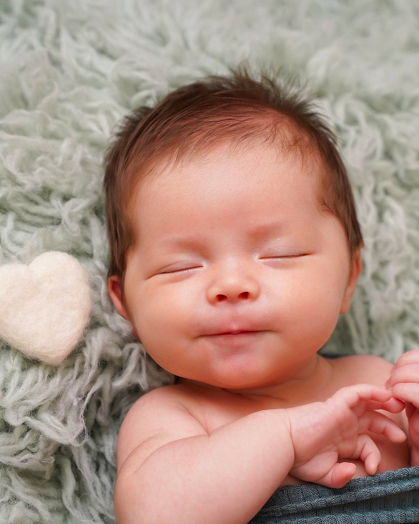 Alistair is registered to the contest to win money with this photo: baby, baby_toddler_clothing, cheek, child, chin, close_up, comfort, eyelash, face, finger, gesture, hand, happy, iris, lip, mouth, nose, person, pink, skin