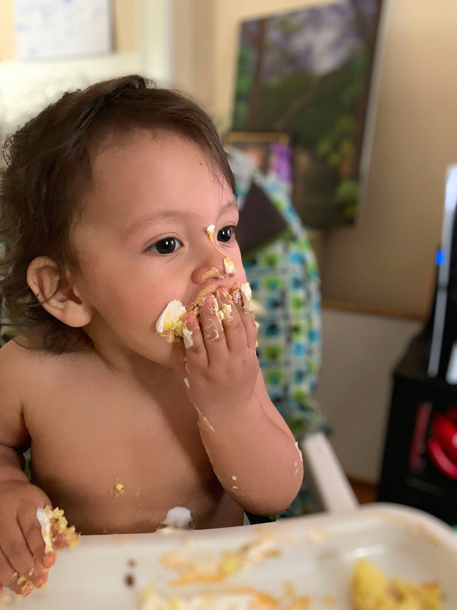Benji is registered to the contest to win money with this photo: baby, baby_playing_with_food, biting, chair, child, comfort_food, cuisine, dish, eating, eyelash, face, food, food_craving, junk_food, person, plate, sharing, sweetness, table, tableware
