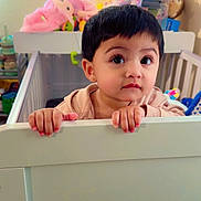 Ziva joined the competition — help win amazing prizes! toddler, child, crib, toys, stuffed_animals, nursery, baby, indoor, furniture, curious, portrait, face, hands, clothing, room, young_child, cute, looking, person, home
