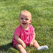 Audri joined the competition — help win amazing prizes! baby, child, grass, outdoor, smiling, sunlight, sitting, happy, pink_clothing, white_shoes, nature, cute, infant, young_child, greenery, daylight, playful, portrait, baby_boy_or_girl, casual