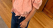 Alianna is registered to the contest to win money with this photo: child, girl, smiling, portrait, standing, indoors, pink_top, jeans, sneakers, necklace, brown_hair, face, dining_room, wood_floor, chairs, furniture, carpet, home, casual_clothing, happy