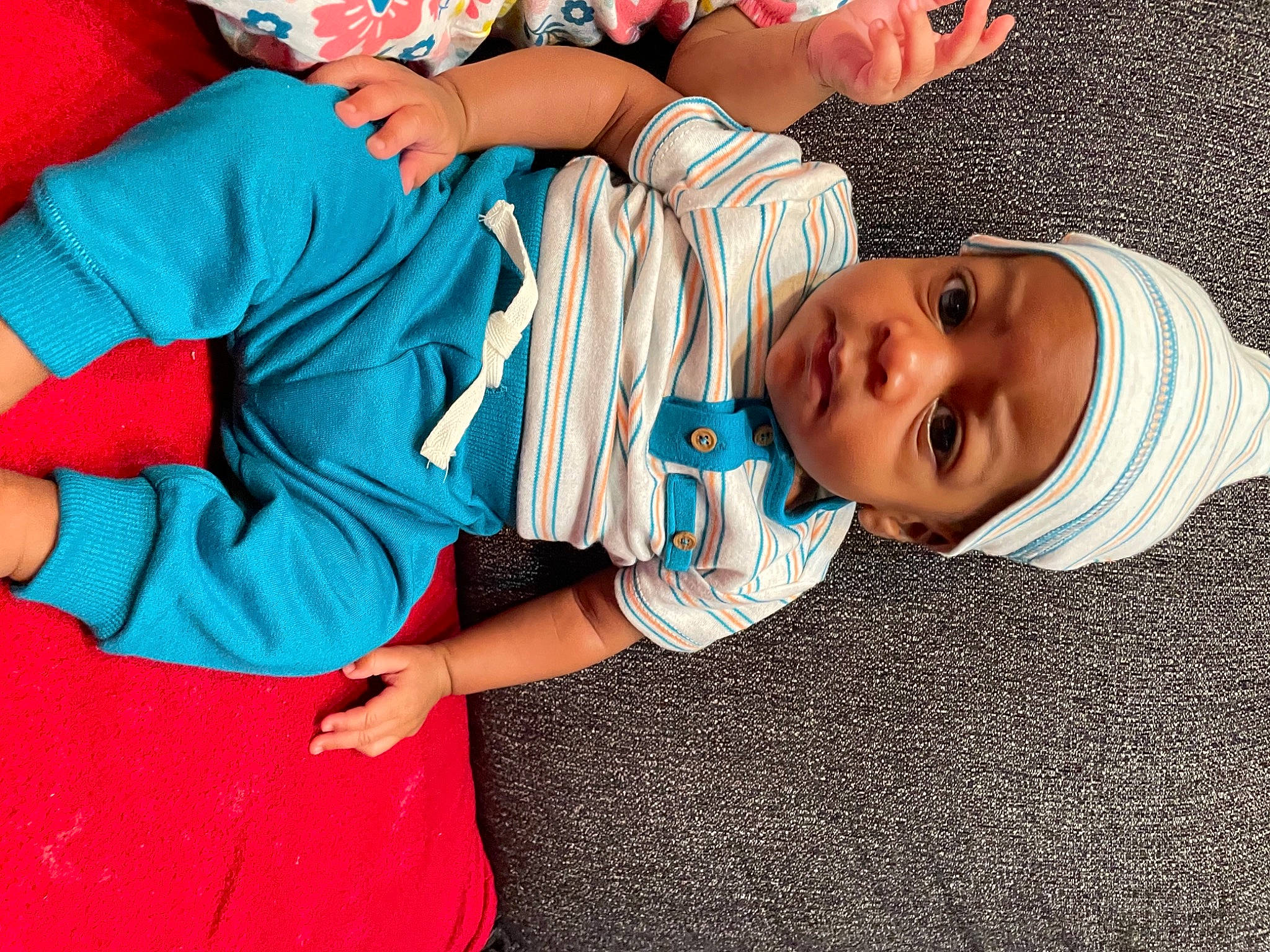 Kasen is registered to the contest to win money with this photo: arm, baby, baby_toddler_clothing, comfort, elbow, electric_blue, finger, hand, happy, hat, headwear, human_body, joint, leisure, person, red, sleeve, smile, t_shirt, thigh