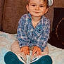 Kélyan a rejoint le concours — aidez-le/la à gagner de superbes lots ! toddler, child, boy, plaid_shirt, cap, sneakers, blue_shoes, couch, blanket, indoor, smile, face, hands, sitting, clothing, young_child, casual, cute, portrait, person