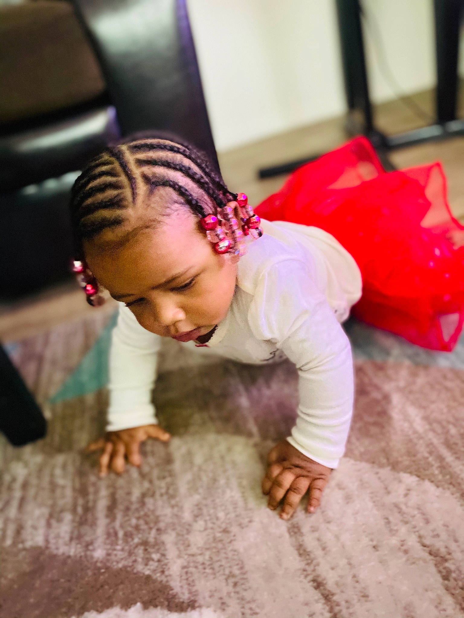 Kamiah is registered to the contest to win money with this photo: beauty, braid, child_model, cornrows, dreadlocks, eyelash, floor, flooring, hair_accessory, hairstyle, nose, person, pink, toddler