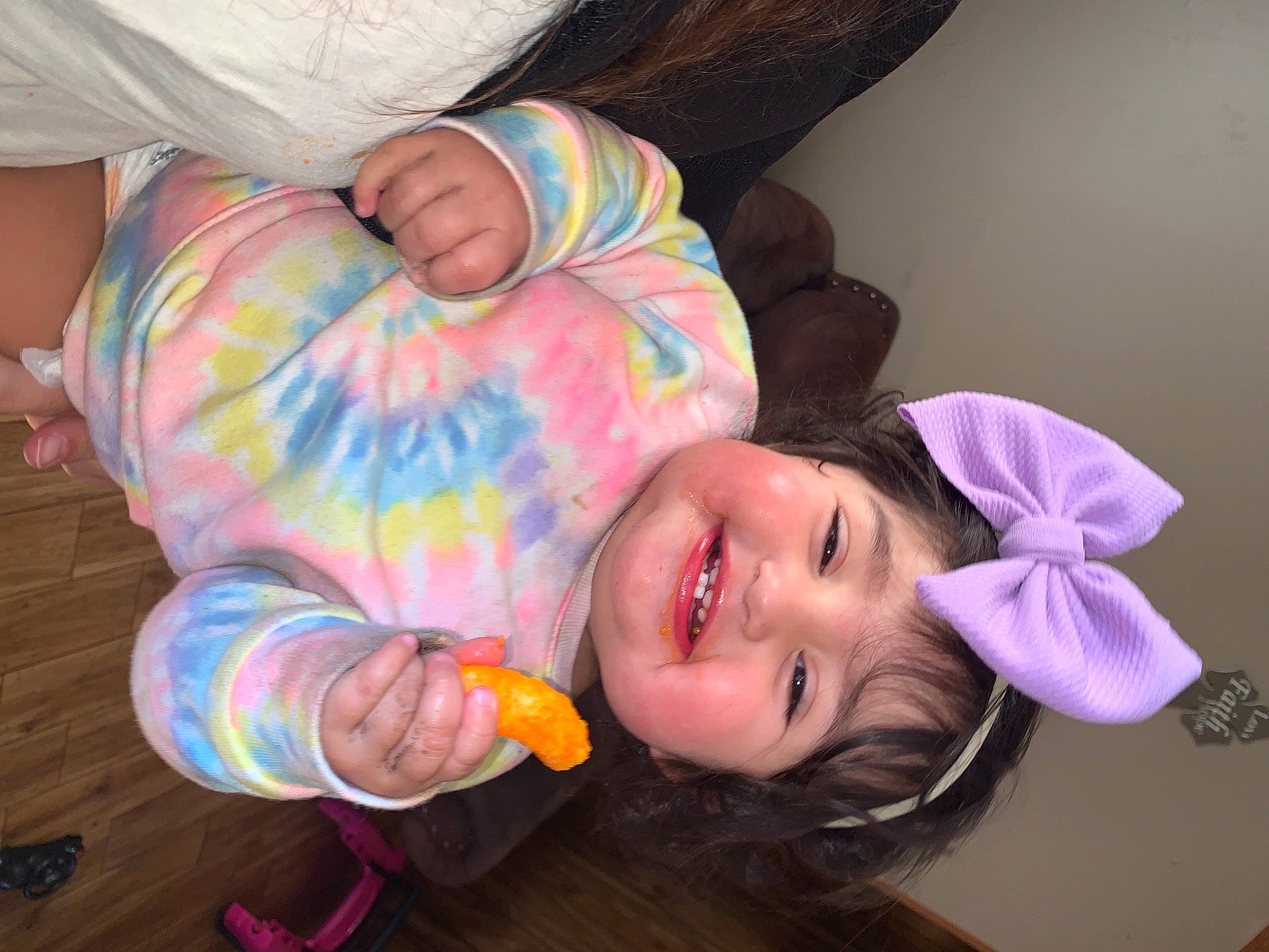 Emilee is registered to the contest to win money with this photo: baby, baby_toddler_clothing, cheek, child, ear, face, fashion_accessory, finger, fun, happy, head, headwear, iris, joy, magenta, nose, person, pink, purple, room