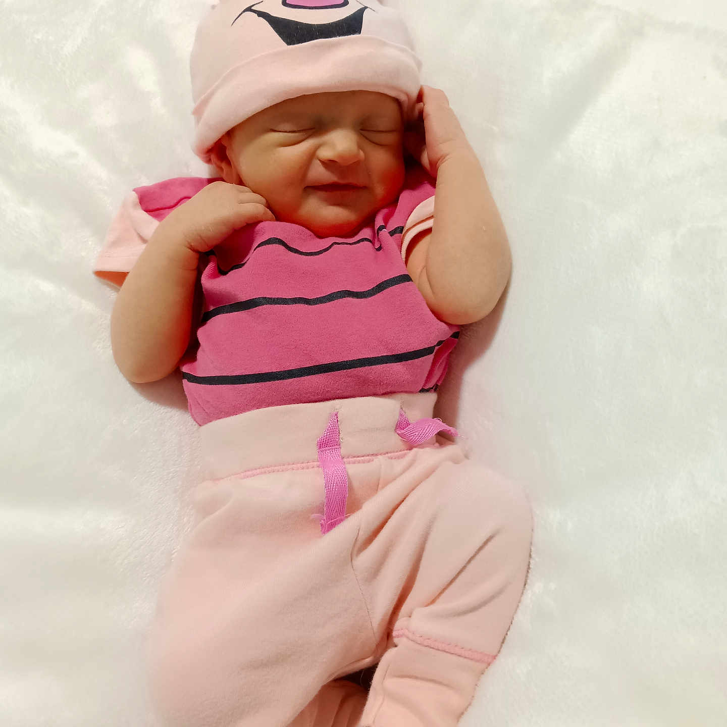 Harper is registered to the contest to win money with this photo: baby, blanket, bodypart, bonnet, cap, clothing, face, finger, furniture, glove, hand, happy, hat, head, newborn, person, photography, portrait, sleeping, smile