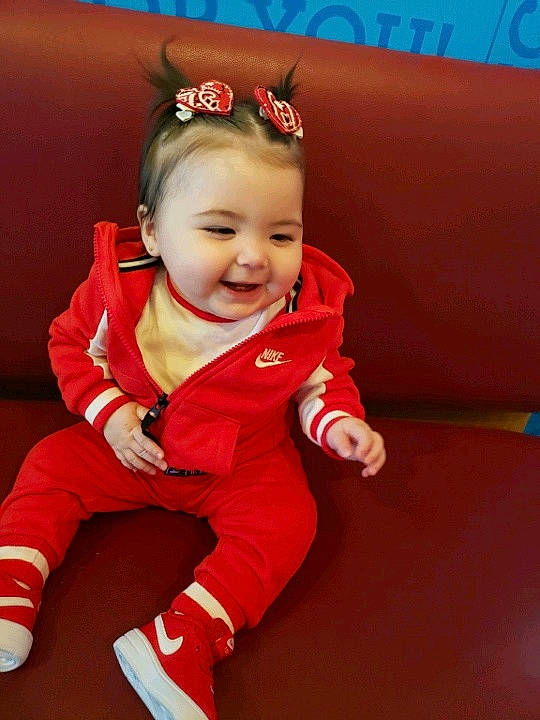 Karma is registered to the contest to win money with this photo: baby, cheek, child, child_model, joy, person, red, sitting, skin, smile, toddler