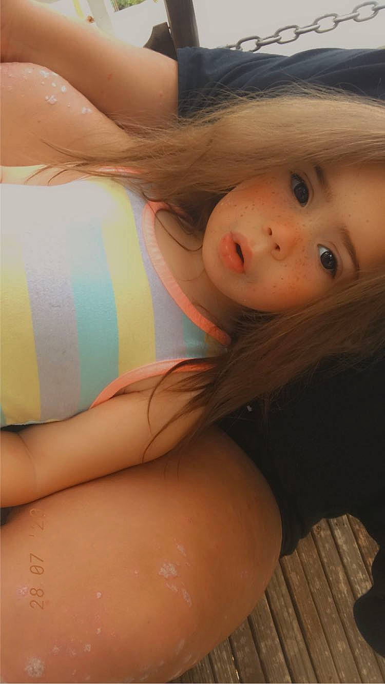 Ava is registered to the contest to win money with this photo: abdomen, black_hair, blond, brown_hair, chest, close_up, eyelash, hat, human_leg, lingerie, lip, long_hair, navel, neck, person, skin, summer, thigh, trunk, undergarment