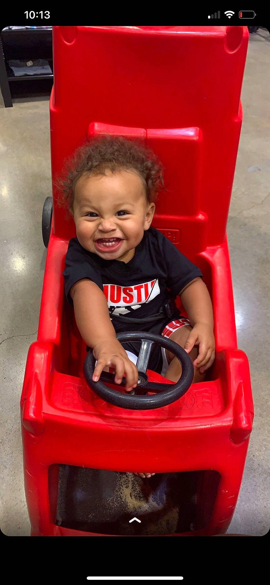Braelon joined the competition — help win amazing prizes! auto_part, automotive_design, automotive_exterior, baby, baby_playing_with_toys, baby_toddler_clothing, bumper, child, fun, happy, head, motor_vehicle, person, plastic, recreation, red, riding_toy, sitting, smile, toddler