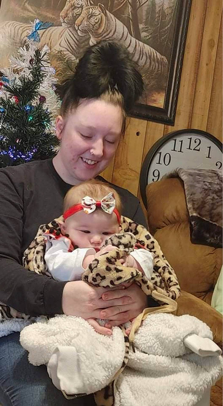 Alexia joined the competition — help win amazing prizes! baby, baby_toddler_clothing, child, christmas_tree, comfort, event, fawn, fun, fur, happy, head, holiday, joy, lap, person, picture_frame, sitting, smile, teddy_bear, toddler