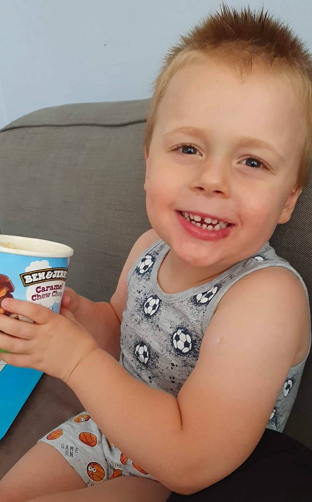 Marcel is registered to the contest to win money with this photo: arm, baby_toddler_clothing, cheek, child, cup, drinkware, elbow, eyelash, finger, flash_photography, fun, hand, happy, iris, joy, neck, person, skin, sleeve, smile