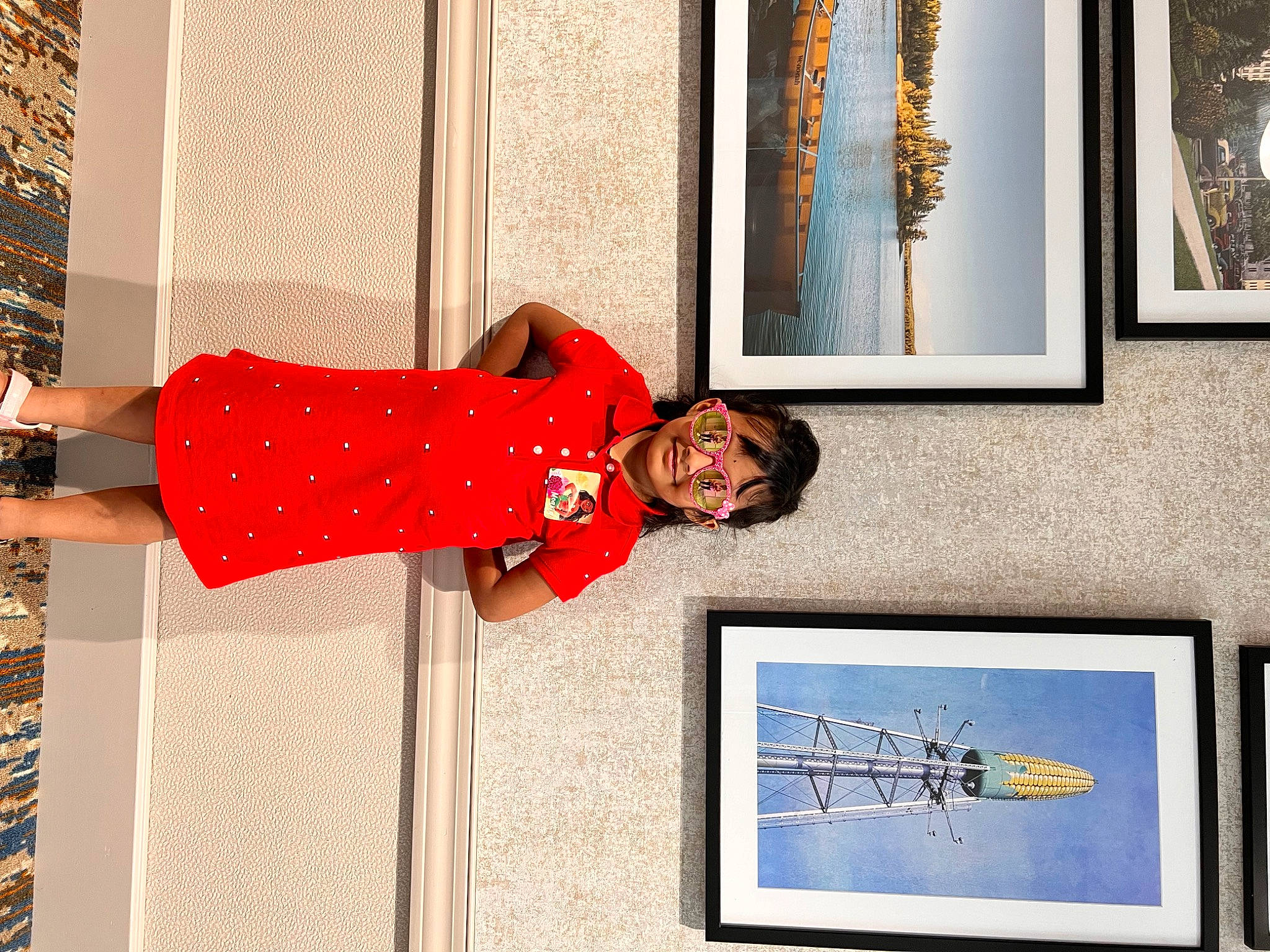 Advika is registered to the contest to win money with this photo: art, carmine, facade, human_leg, interior_design, line, pattern, person, photograph, picture_frame, rectangle, red, room, smile, thigh, tree, visual_arts, waist, wall, window