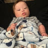 Karsten joined the competition — help win amazing prizes! baby, blanket, child, clothing, comfort, cute, dog_pattern, face, furniture, hand, indoor, lying_down, person, portrait, resting, soft_texture, toddler, warm, wood_floor, young_child