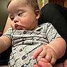 Karsten is registered to the contest to win money with this photo: baby, candid, casual, child, closeup, clothing, curious, expression, face, foot, hand, indoor, infant, onesie, person, portrait, skin, soft_light, toddler, young