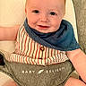 baby, infant, smiling, face, blue_bib, striped_clothing, baby_seat, happy, cute, child, sitting, skin, head, eyes, mouth, expression, indoor, closeup, person, portrait
