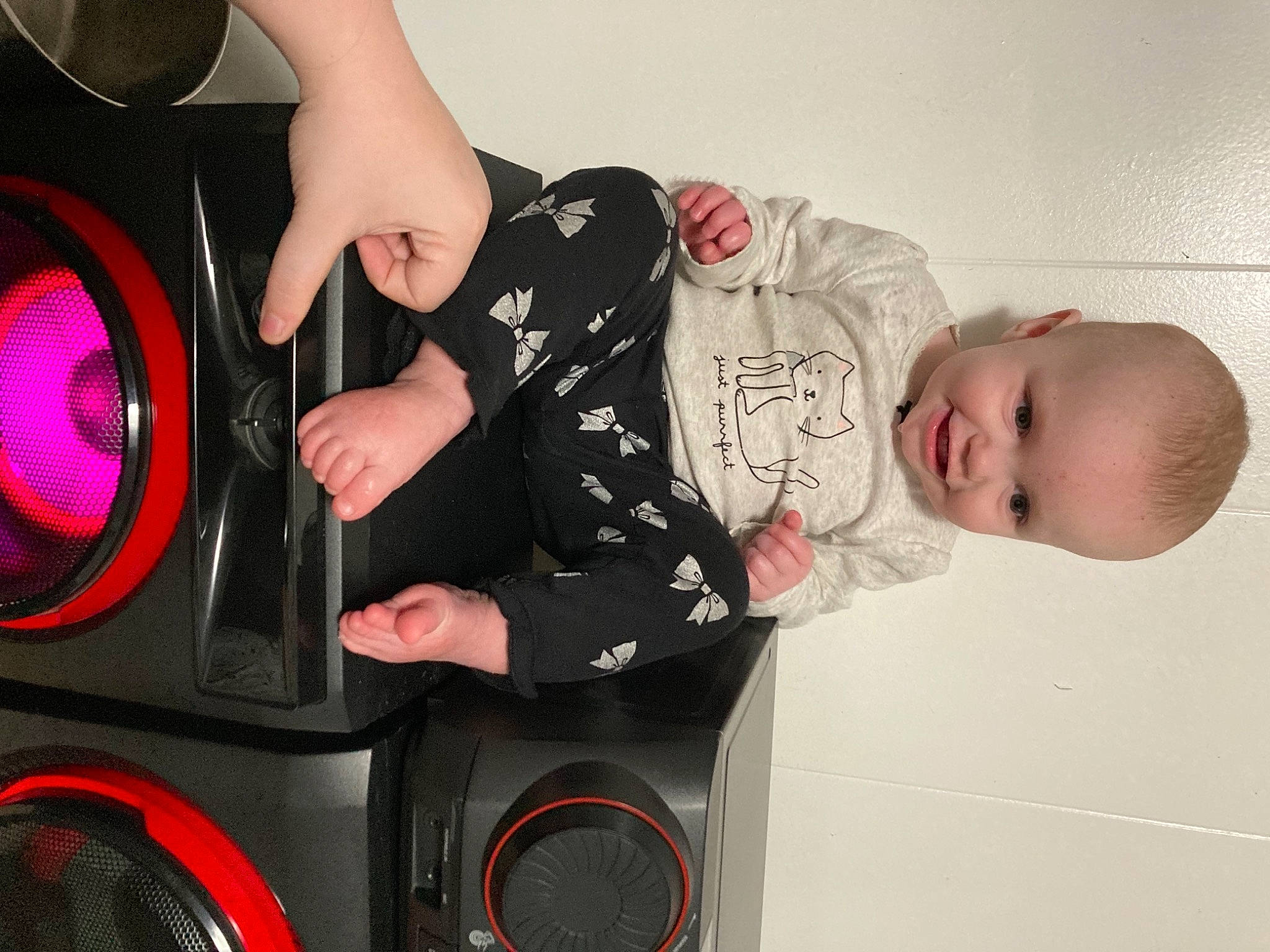 Riley joined the competition — help win amazing prizes! audio_equipment, auto_part, automotive_design, automotive_lighting, baby, baby_products, baby_toddler_clothing, car_subwoofer, circle, comfort, fashion_accessory, finger, flash_photography, loudspeaker, magenta, person, pink, product, room, toddler