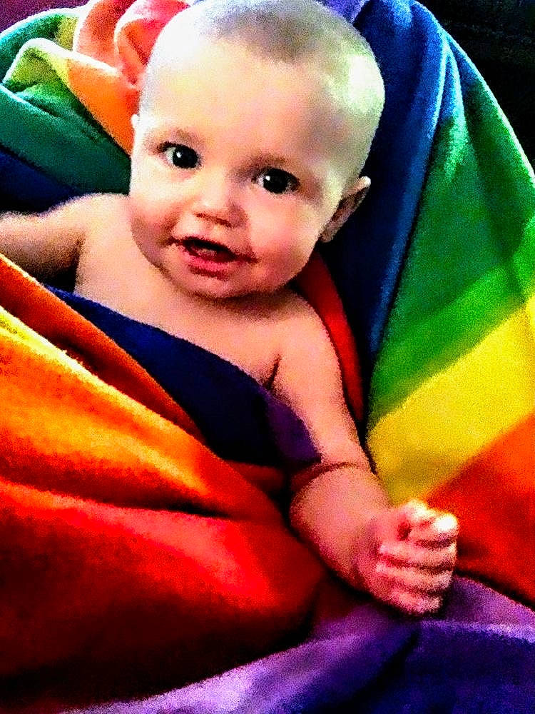 Riley joined the competition — help win amazing prizes! arm, baby, cheek, comfort, eye, eyebrow, facial_expression, gesture, hand, happy, human_body, iris, lip, mouth, nose, person, product, skin, sleeve, smile