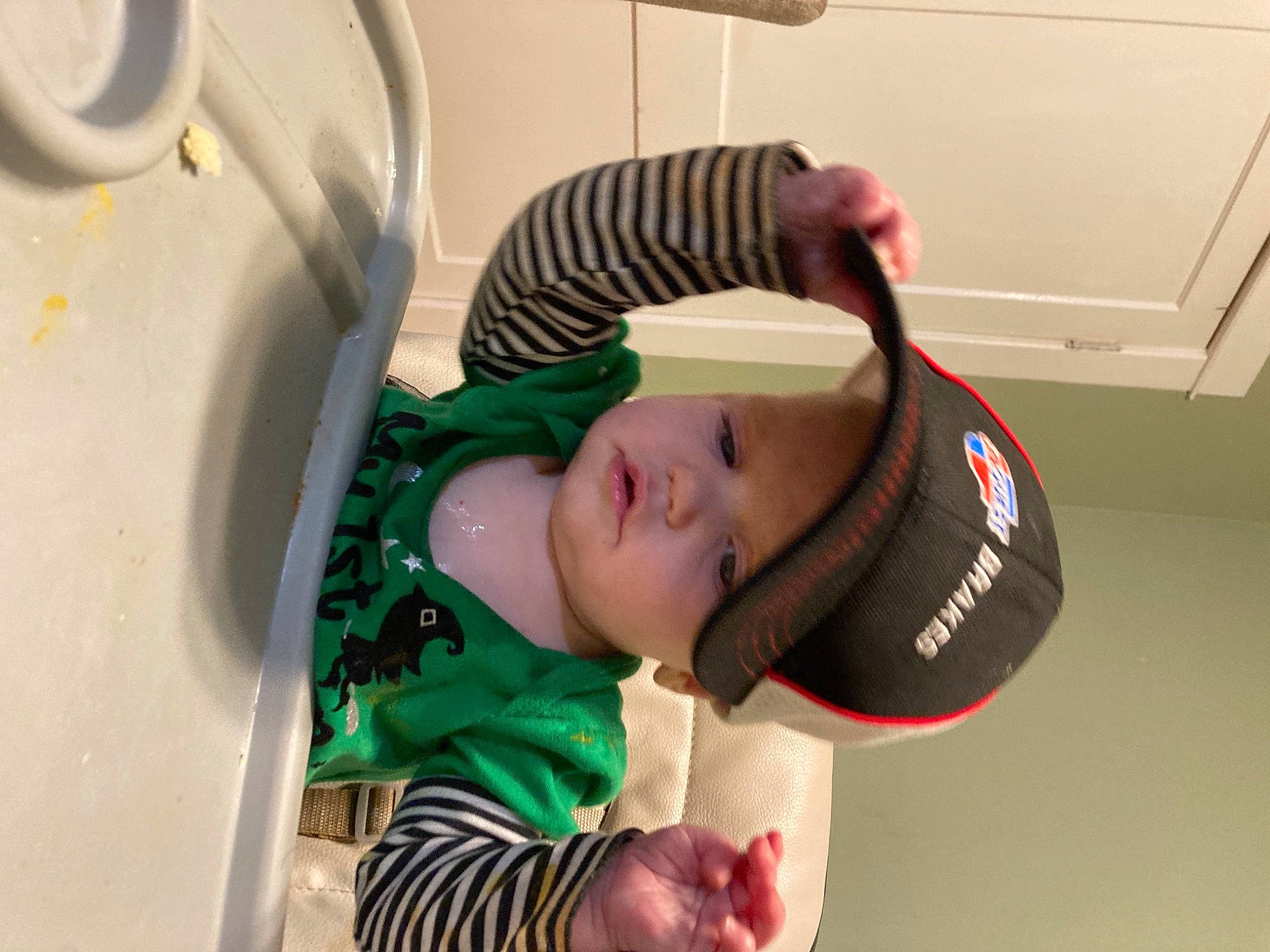 Riley is registered to the contest to win money with this photo: audio_equipment, baby, baby_products, baby_toddler_clothing, bathroom, cap, child, elbow, eyelash, eyewear, fashion_accessory, happy, hat, headwear, hearing, person, personal_protective_equipment, plumbing_fixture, room, sports_gear