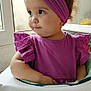 toddler, child, purple_headband, purple_dress, high_chair, window, indoor, cute, portrait, baby, face, person, sitting, clothing, headwear, curly_hair, looking_away, young_child, innocent, casual