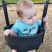 Andrew joined the competition — help win amazing prizes! toddler, baby, swing, playground, outdoor, child, blue_shirt, wood_chips, fence, plastic, grass, summer, daylight, curious, seat, holding, nature, cute, young_child, park