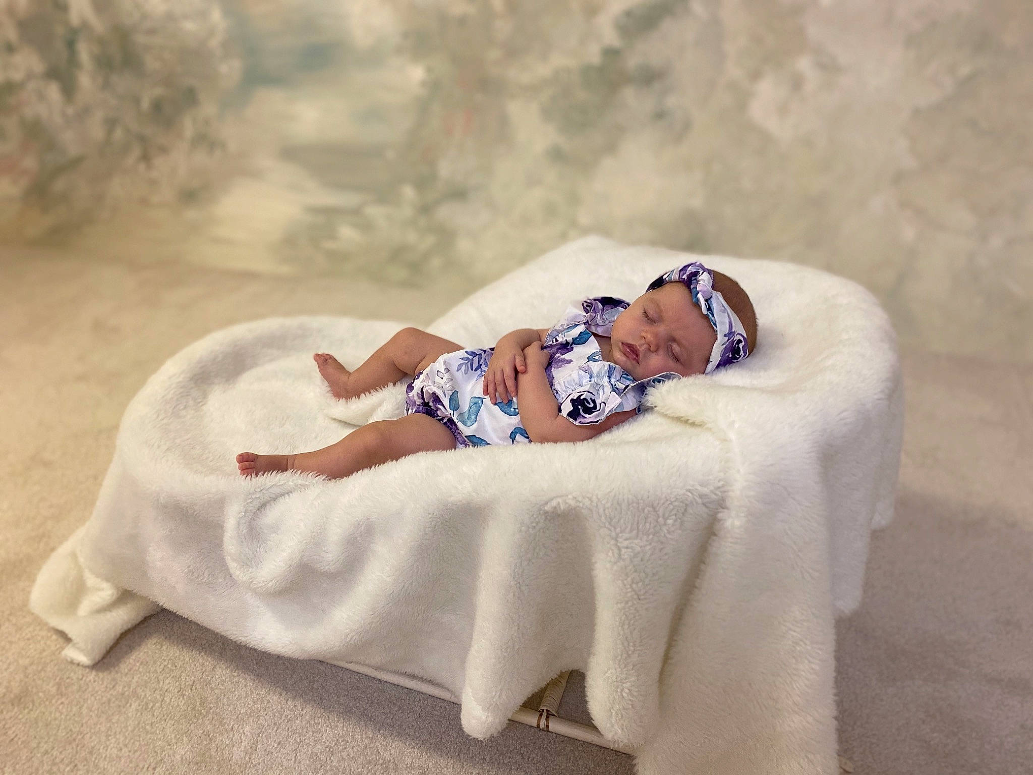 Beretta is registered to the contest to win money with this photo: baby, child, comfort, dress, event, fun, grass, happy, hat, headwear, human_body, human_leg, landscape, leg, leisure, linens, mammal, person, sandal, sitting