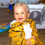 Tino participe au concours pour gagner de l'argent avec cette photo : baby, babylaughing, bodypart, citrusfruit, clothing, coat, face, finger, food, fruit, hand, happy, head, jacket, laughing, person, photography, portrait, sitting, smile