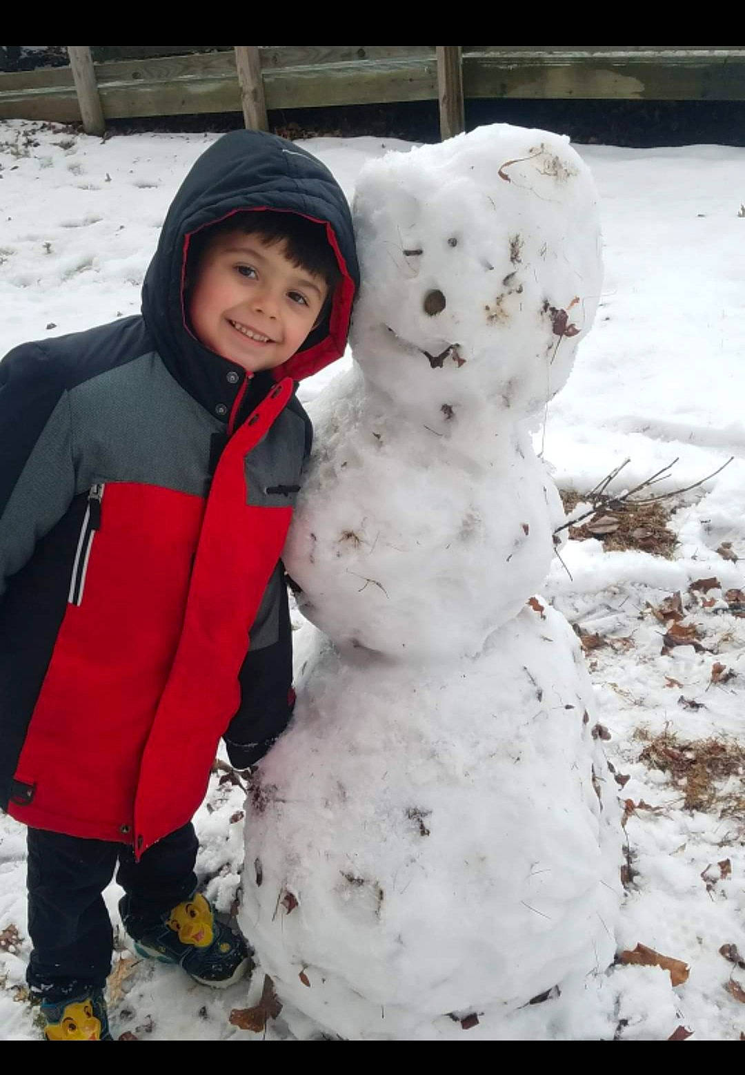 Julien joined the competition — help win amazing prizes! freezing, headwear, joy, person, playing_in_the_snow, smile, snow, snowman, winter