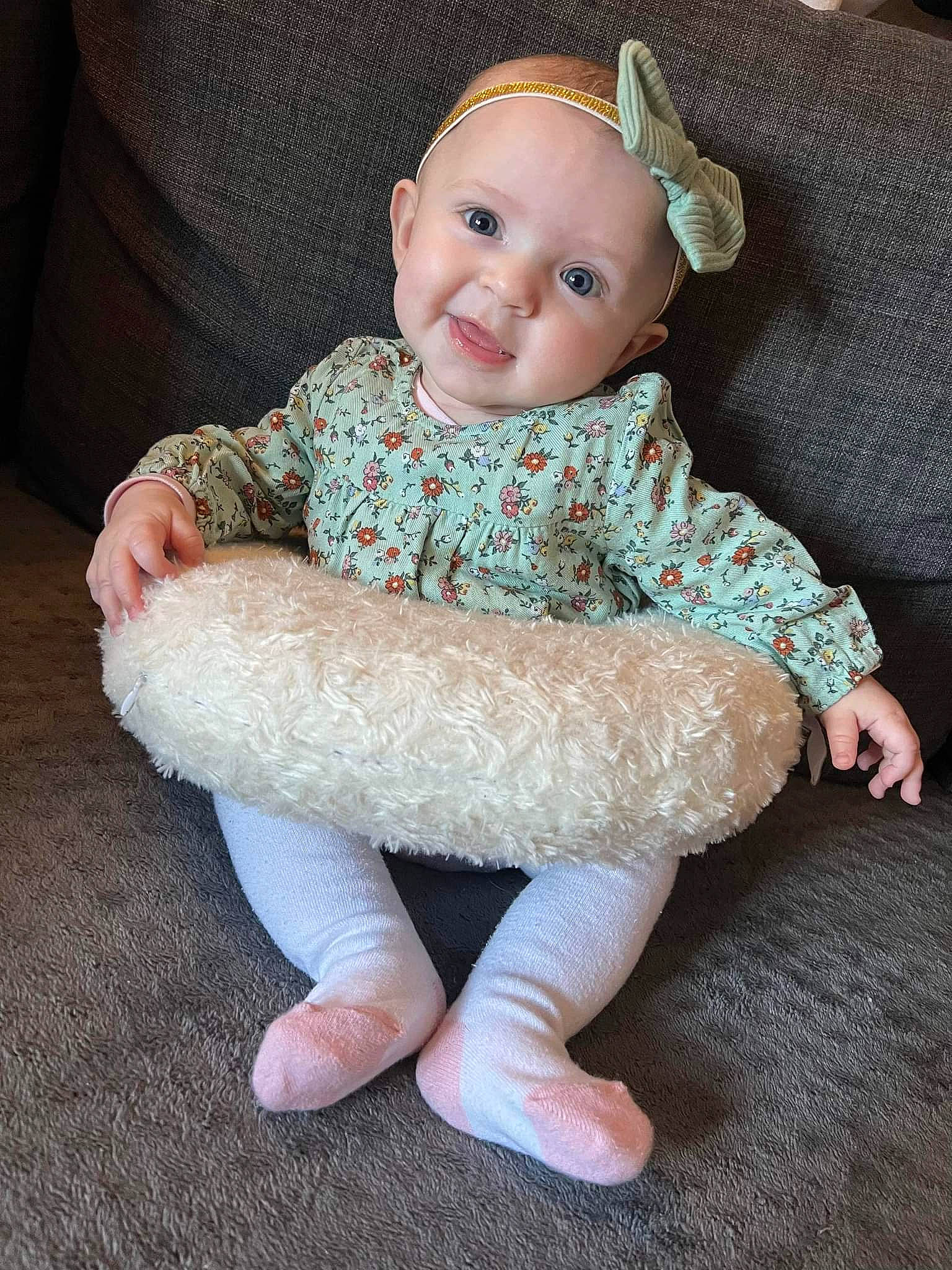 Ana participe au concours pour gagner de l'argent avec cette photo : art, baby, baby_toddler_clothing, cheek, child, craft, doll, fashion_accessory, foot, fur, iris, pattern, person, sitting, skin, sleeve, smile, sock, toddler, wool