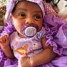 baby, basket, blanket, child, closeup, clothing, cute, fabric, headband, indoors, infant, newborn, pacifier, person, plush_toy, portrait, purple, smiling, soft, tulle