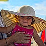 Liyana participe au concours pour gagner de l'argent avec cette photo : baby, child, smile, hat, sun_hat, pink_swimsuit, hand, adult_hand, outdoor, sunlight, summer, sky, portrait, cute, person, infant, happy, vacation, holding, closeup