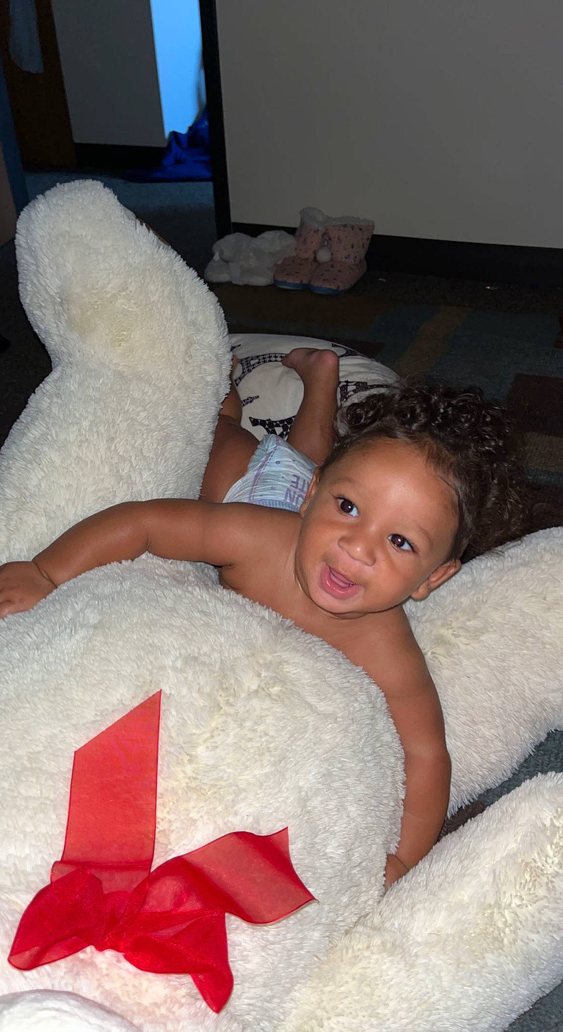 Kentrell is registered to the contest to win money with this photo: bed, bedding, child, comfort, couch, event, finger, flash_photography, flooring, fun, fur, hand, happy, lap, linens, person, room, sitting, smile, textile