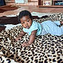 animal, baby, babycrawling, bed, bedroom, blanket, clothing, couch, crawling, face, furniture, head, homedecor, indoors, panther, person, photography, portrait, quilt, room