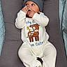 Ace joined the competition — help win amazing prizes! baby, infant, beanie, onesie, deer_design, cushion, gray, slippers, cute, lying_down, finger_in_mouth, looking_sideways, soft_texture, cozy, child, indoors, sleepwear, plush, comfortable, resting