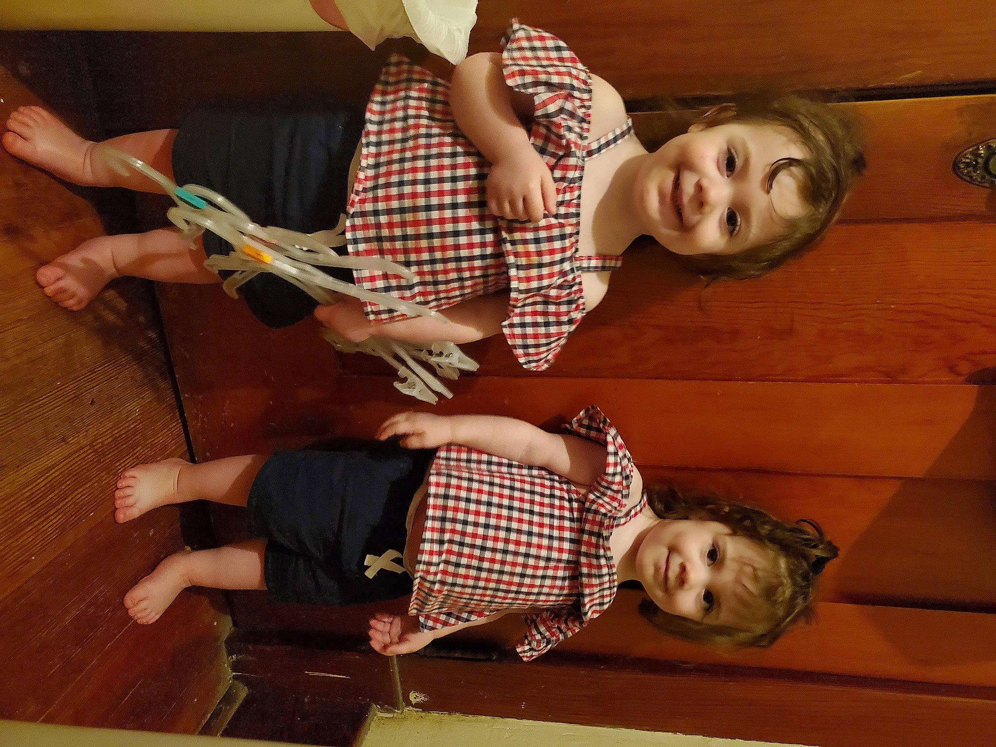 Kharagun And Kheringtyn is registered to the contest to win money with this photo: arm, comfort, elbow, flooring, foot, fun, gesture, happy, hardwood, human_leg, joy, knee, leg, pattern, person, plaid, room, smile, tartan, thigh