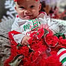 Magnolia is registered to the contest to win money with this photo: baby, infant, red_bow, holiday_clothing, festive, christmas, tutu_skirt, striped_leggings, tongue_out, smiling, cute, portrait, sitting, soft_blanket, indoors, child, happy, festive_colors, red, white