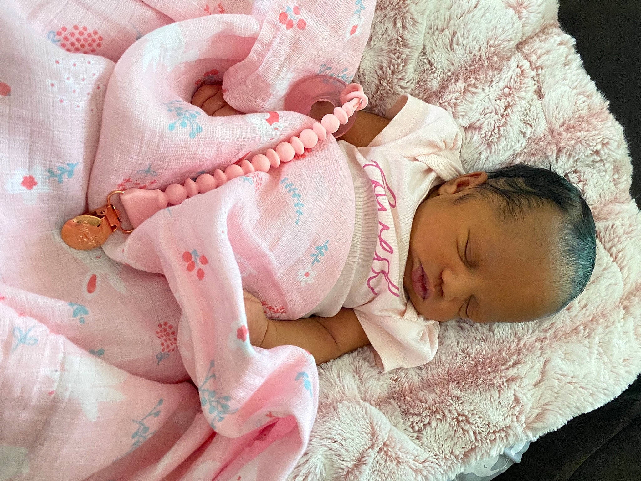 Kobi is registered to the contest to win money with this photo: arm, baby, baby_sleeping, baby_toddler_clothing, cheek, chin, comfort, eye, eyelash, finger, hand, headgear, linens, mouth, nail, person, pink, product, skin, textile