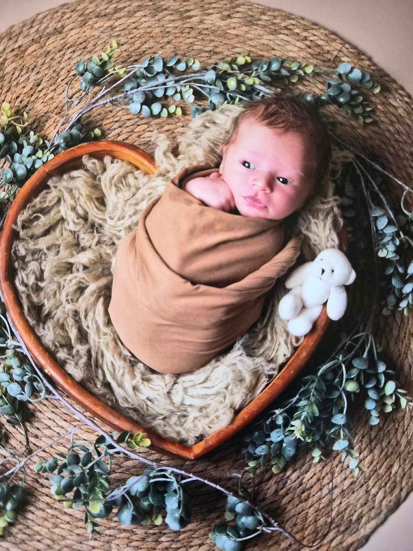 Joey participe au concours pour gagner de l'argent avec cette photo : baby, newborn, swaddle, heart_shaped_bowl, basket, plush_toy, eucalyptus, rustic, blanket, portrait, indoor, face, eyes_open, cozy, soft_texture, wood, woven_mat, prop_photography, cute, newborn_photography