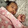 Raeni is registered to the contest to win money with this photo: baby, blanket, face, head, newborn, person, photography, portrait, quilt, sleeping, towel, yawning