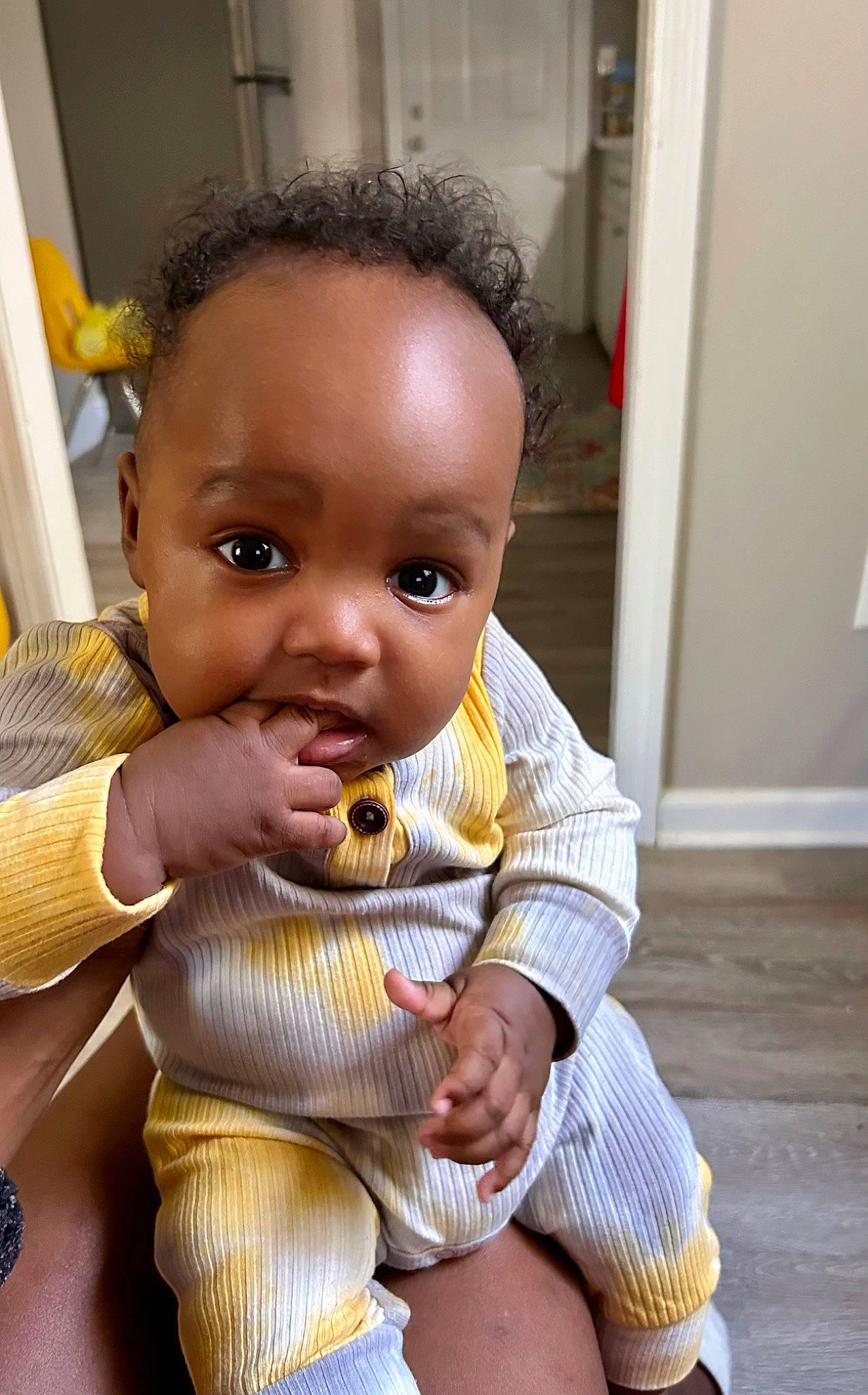 Khalil is registered to the contest to win money with this photo: abdomen, baby, baby_products, baby_toddler_clothing, chair, cheek, chest, child, doll, flooring, gesture, nail, neck, nose, person, sitting, stuffed_toy, thumb, toddler, toy