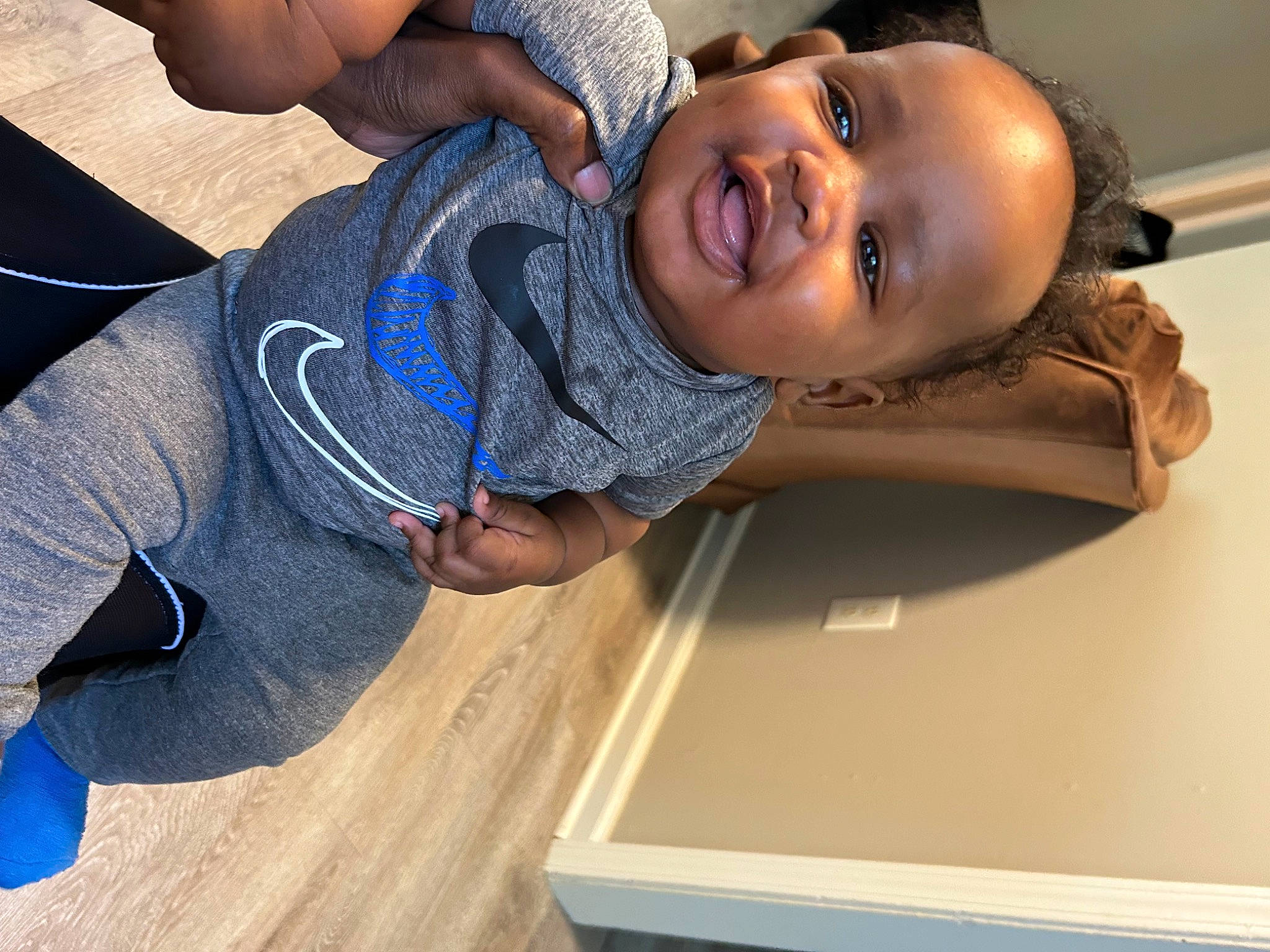 Khalil joined the competition — help win amazing prizes! baby, baby_toddler_clothing, black, cheek, child, comfort, elbow, electric_blue, flooring, fun, happy, hardwood, knee, nose, person, sleeve, smile, t_shirt, toddler, wood