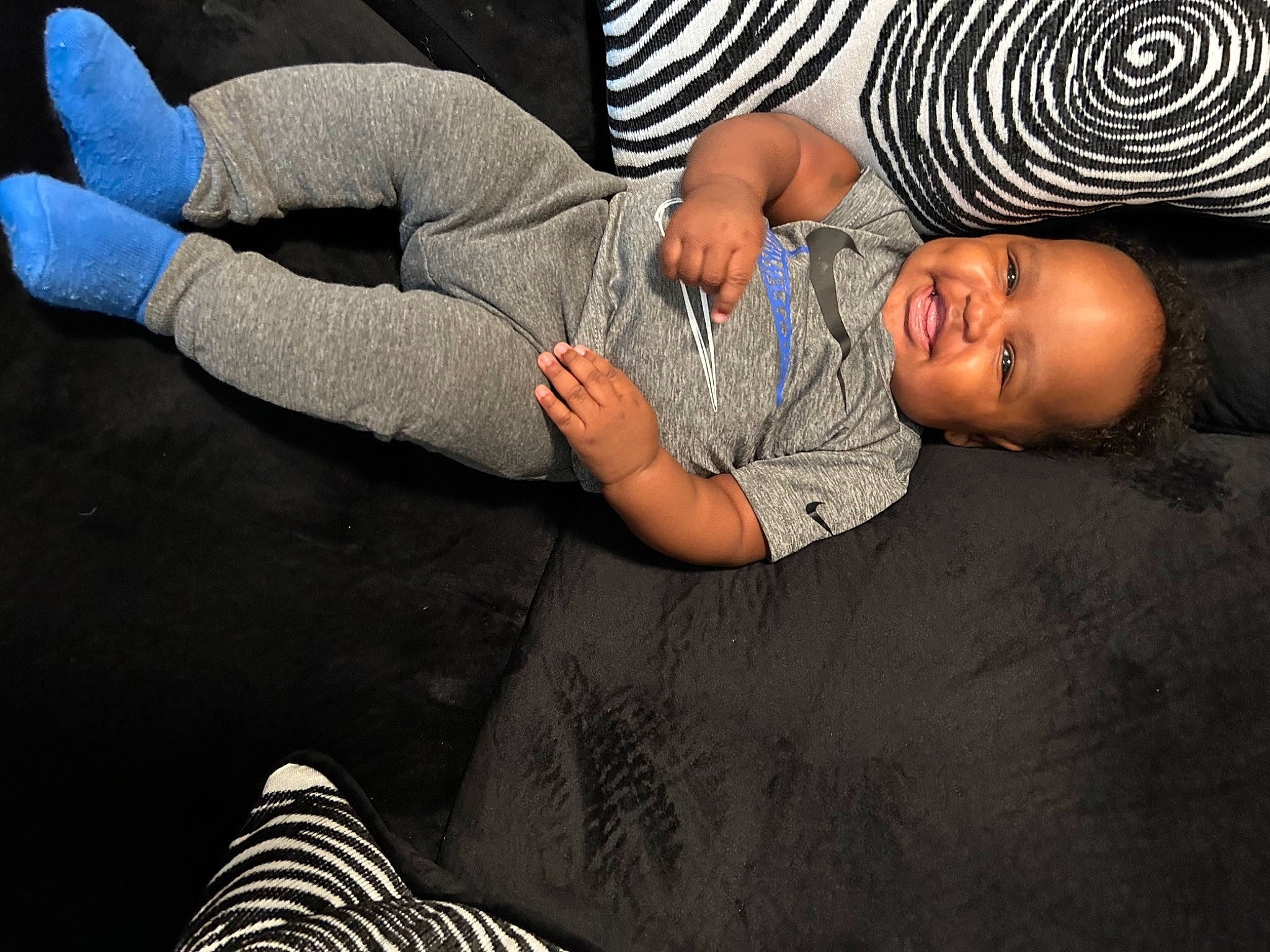 Khalil joined the competition — help win amazing prizes! arm, black, child, comfort, elbow, flash_photography, floor, flooring, fun, gesture, happy, human_leg, joint, knee, light, person, thigh, toddler, white, wood