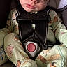 baby, sleeping, car_seat, pajamas, child, infant, strap, cute, peaceful, rest, face, seatbelt, animal_print, small_child, indoors, closeup, comfort, nap, safety, young_child