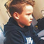 Naël a rejoint le concours — aidez-le/la à gagner de superbes lots ! child, boy, hoodie, nike, indoor, side_profile, focused, casual_clothing, short_hair, couch, sitting, young, person, furniture, serious_expression, home_interior, shelf, bottles, relaxed, portrait