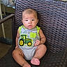Wyatt is registered to the contest to win money with this photo: baby, child, infant, onesie, tractor, green, yellow, gray_clothing, sitting, chair, woven_chair, indoor, curious, cute, foot, hand, face, skin, person, portrait