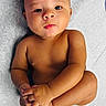 Wyatt is registered to the contest to win money with this photo: baby, infant, diaper, skin, cute, child, portrait, laying, hands, feet, expression, newborn, person, young, face, looking, soft_surface, curious, playful, closeup