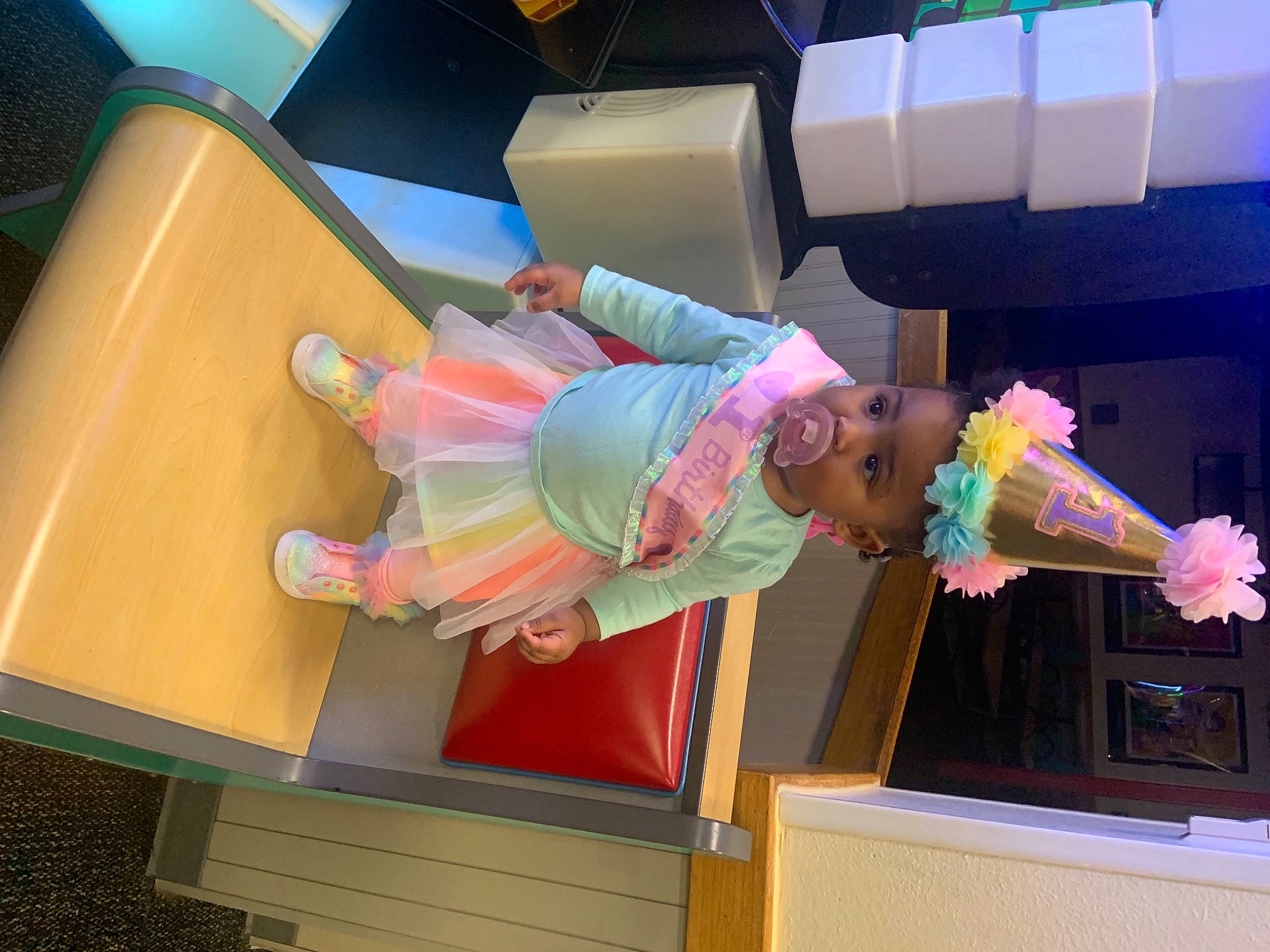 Londynn is registered to the contest to win money with this photo: child, event, fun, leisure, machine, magenta, party, party_supply, person, pink, plastic, play, room, smile, thigh, toddler, water